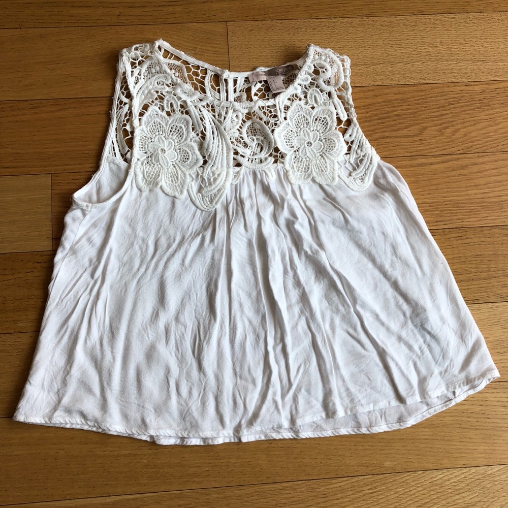 White sleeveless top with lace detail
